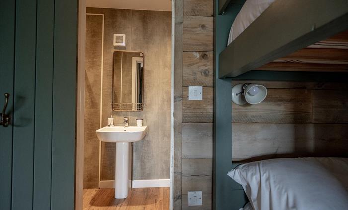 Each Llechwedd Glamping Tent has a fully en-suite shower room with sink and toilet.